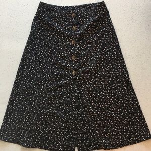Calf length black skirt with pink floral print
